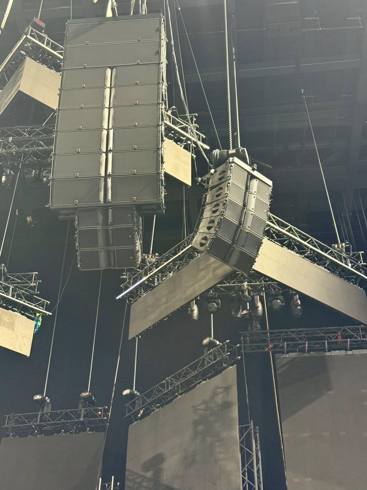 Main line array and side array hanging between truss and LED screens